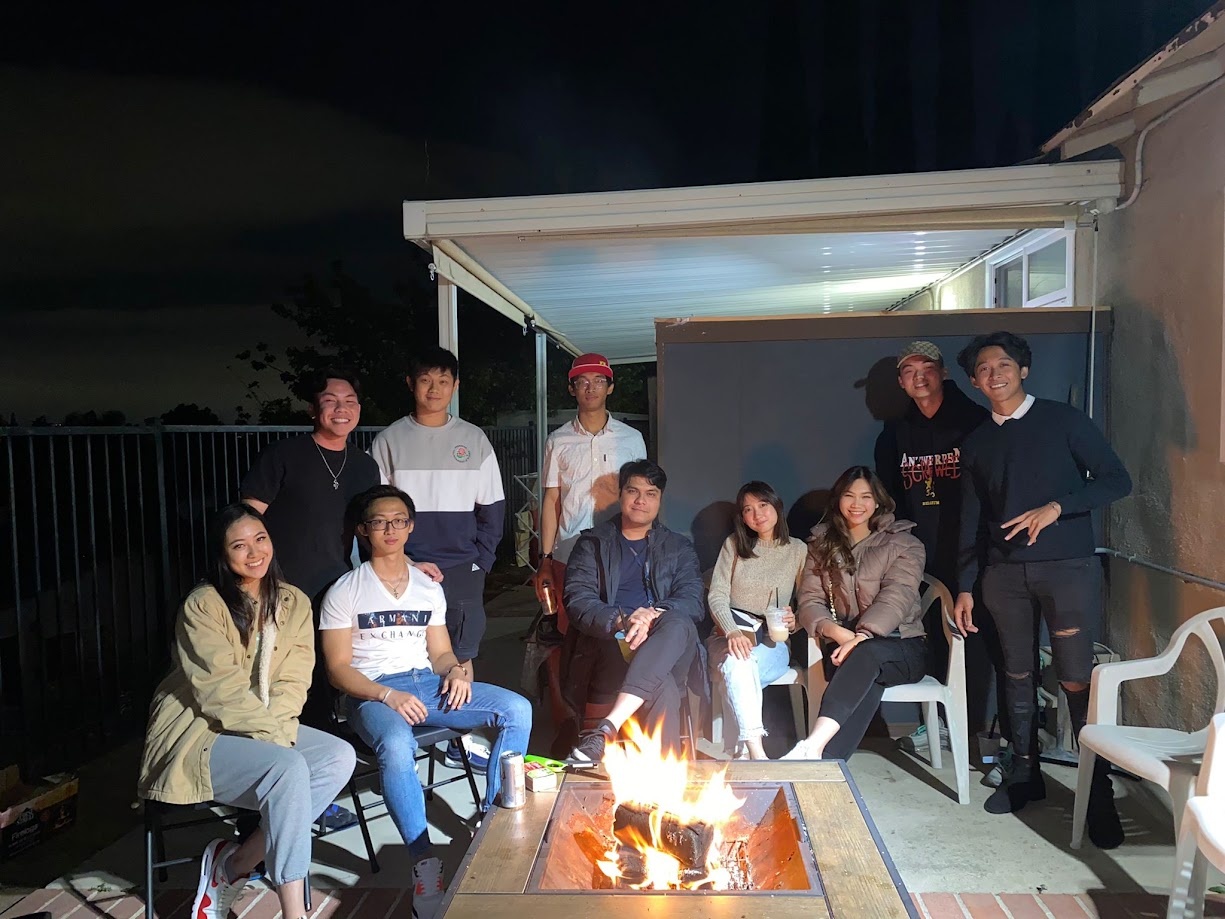 Evening gathering with friends around a backyard fire pit