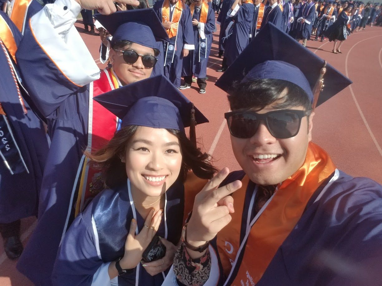 Graduation day photo in cap and gown on the track
