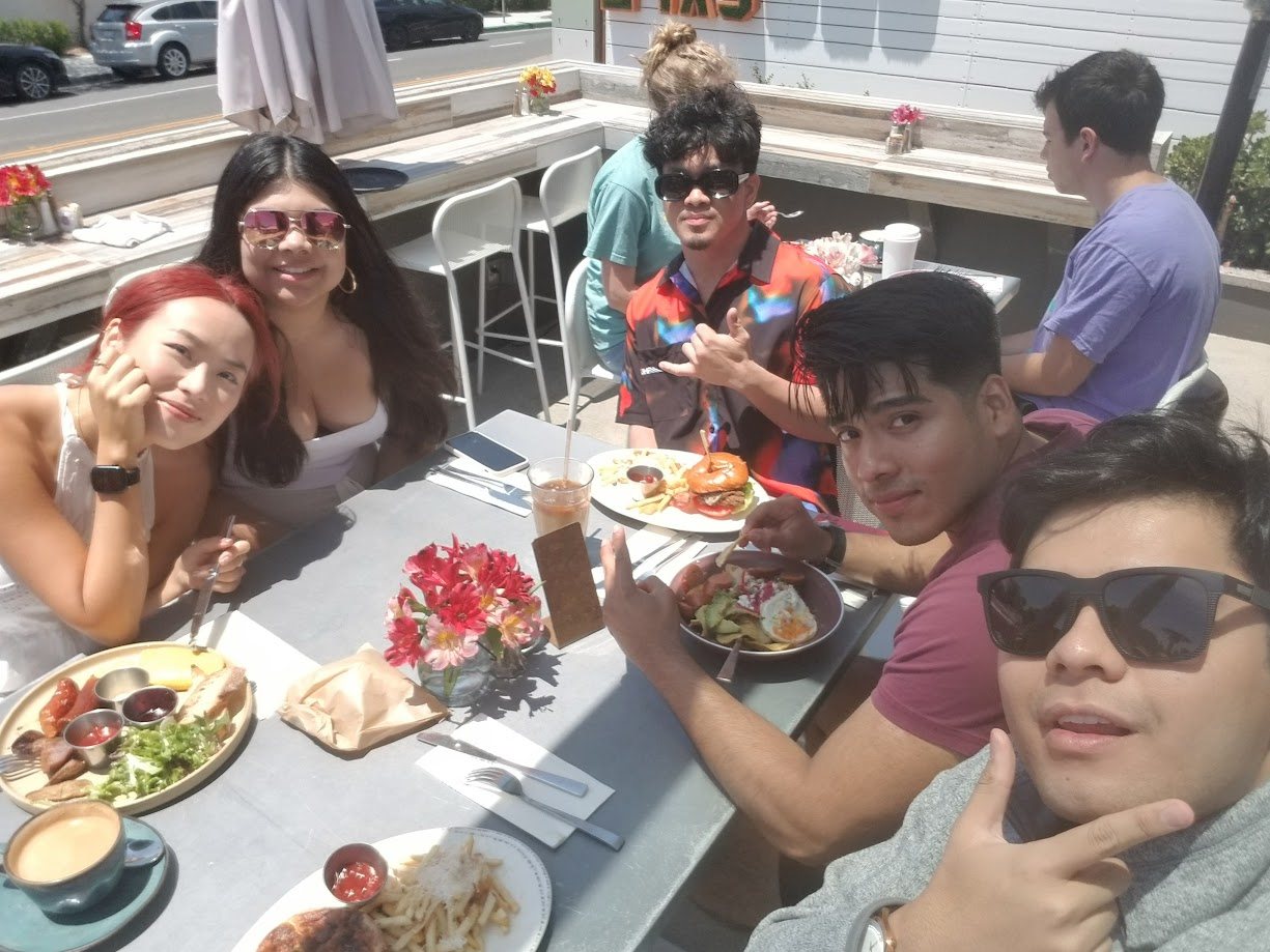 Friends at an outdoor brunch table