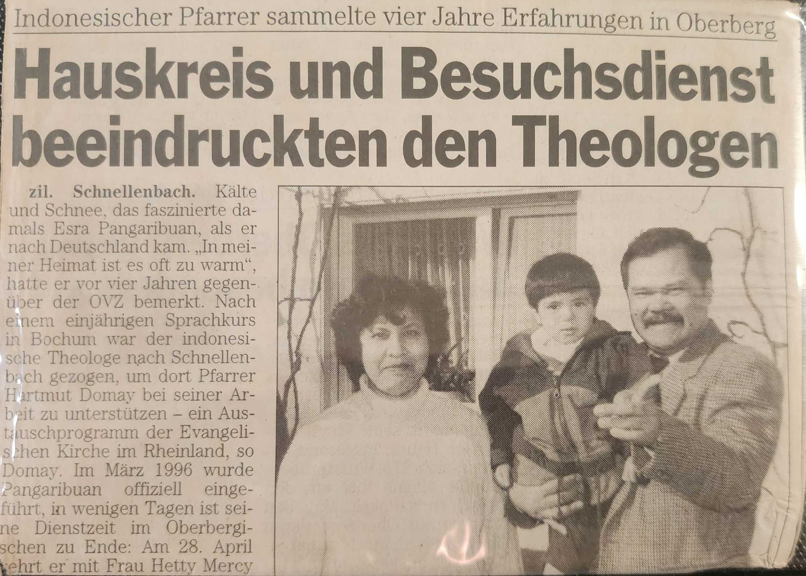 A clipping from the local Oberberg paper about my dad's four years serving there, with a photo of my parents and me