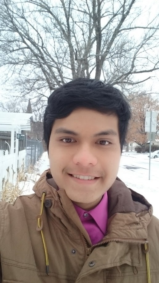 Selfie outdoors with snow on the ground and bare trees