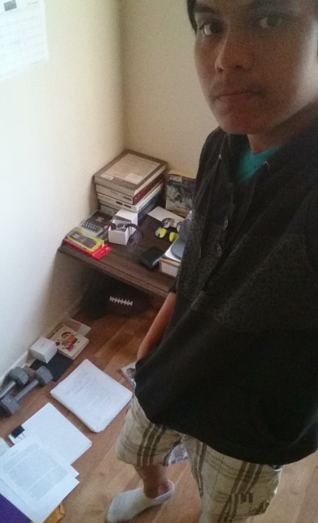 Standing in my room with study papers spread across the floor