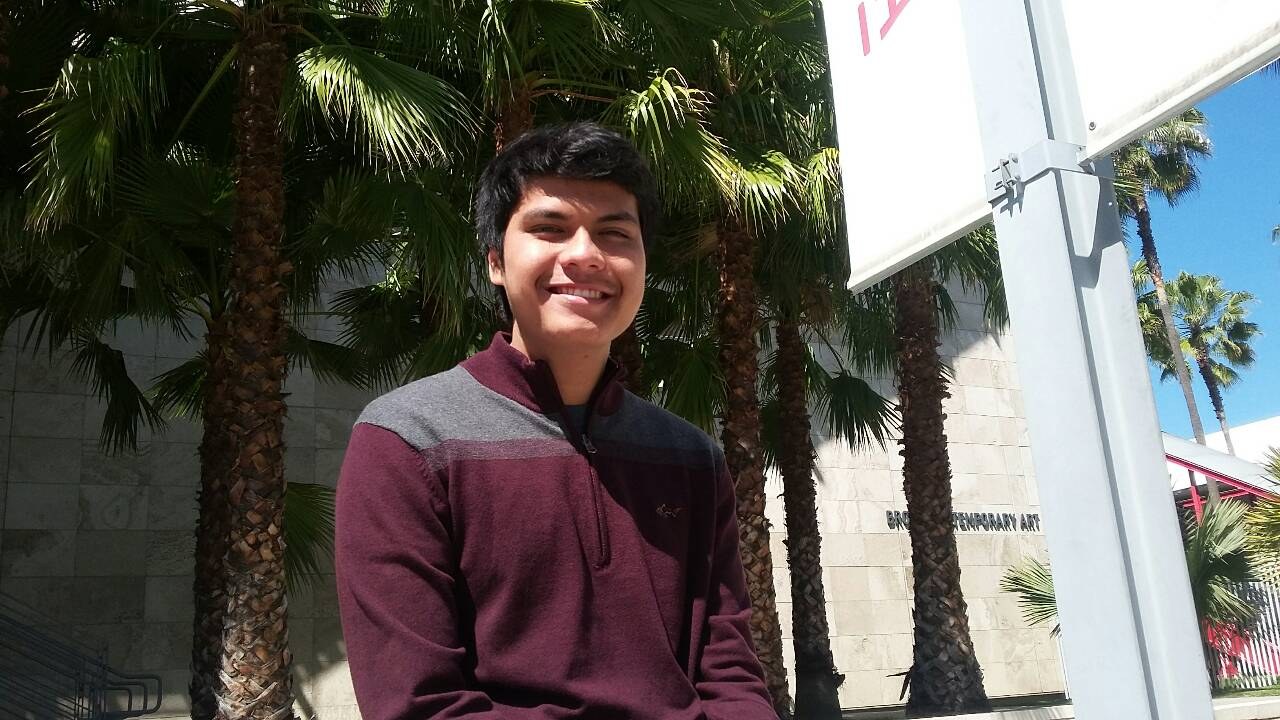 Sitting outside the Broad Contemporary Art building under the palm trees