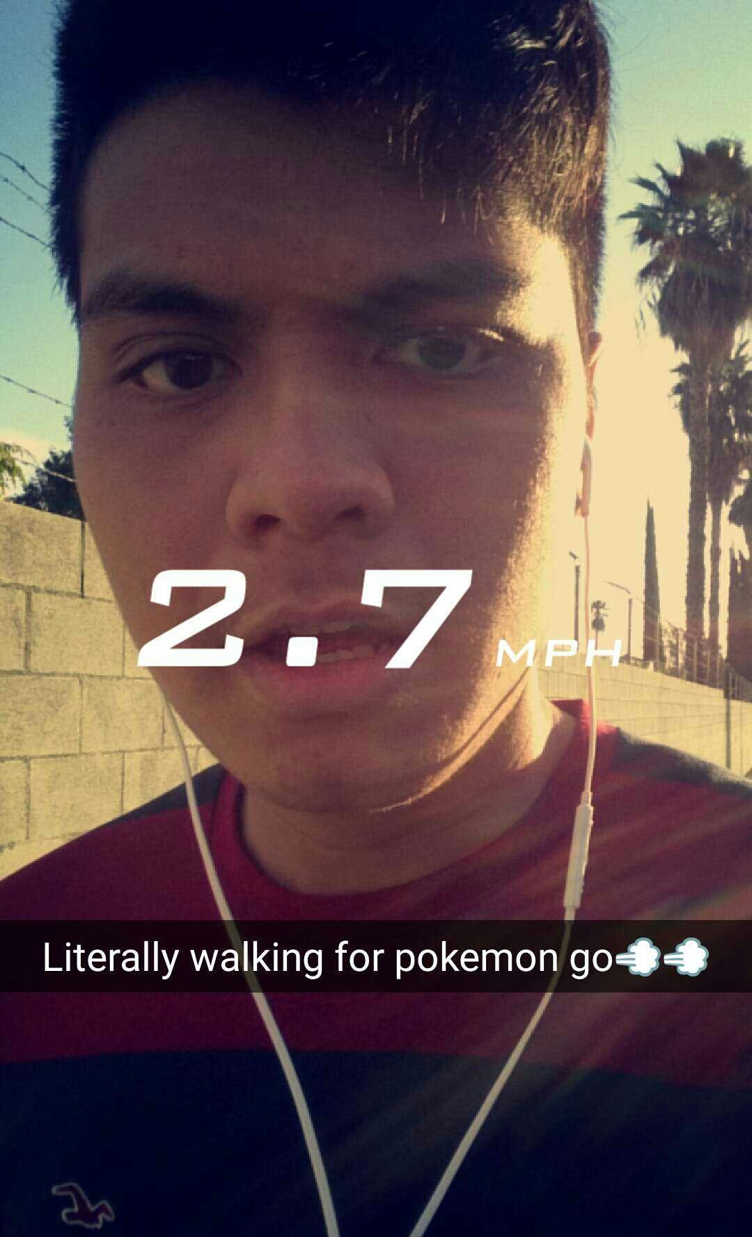 A selfie out on the street with the speed filter reading 2.7 miles an hour