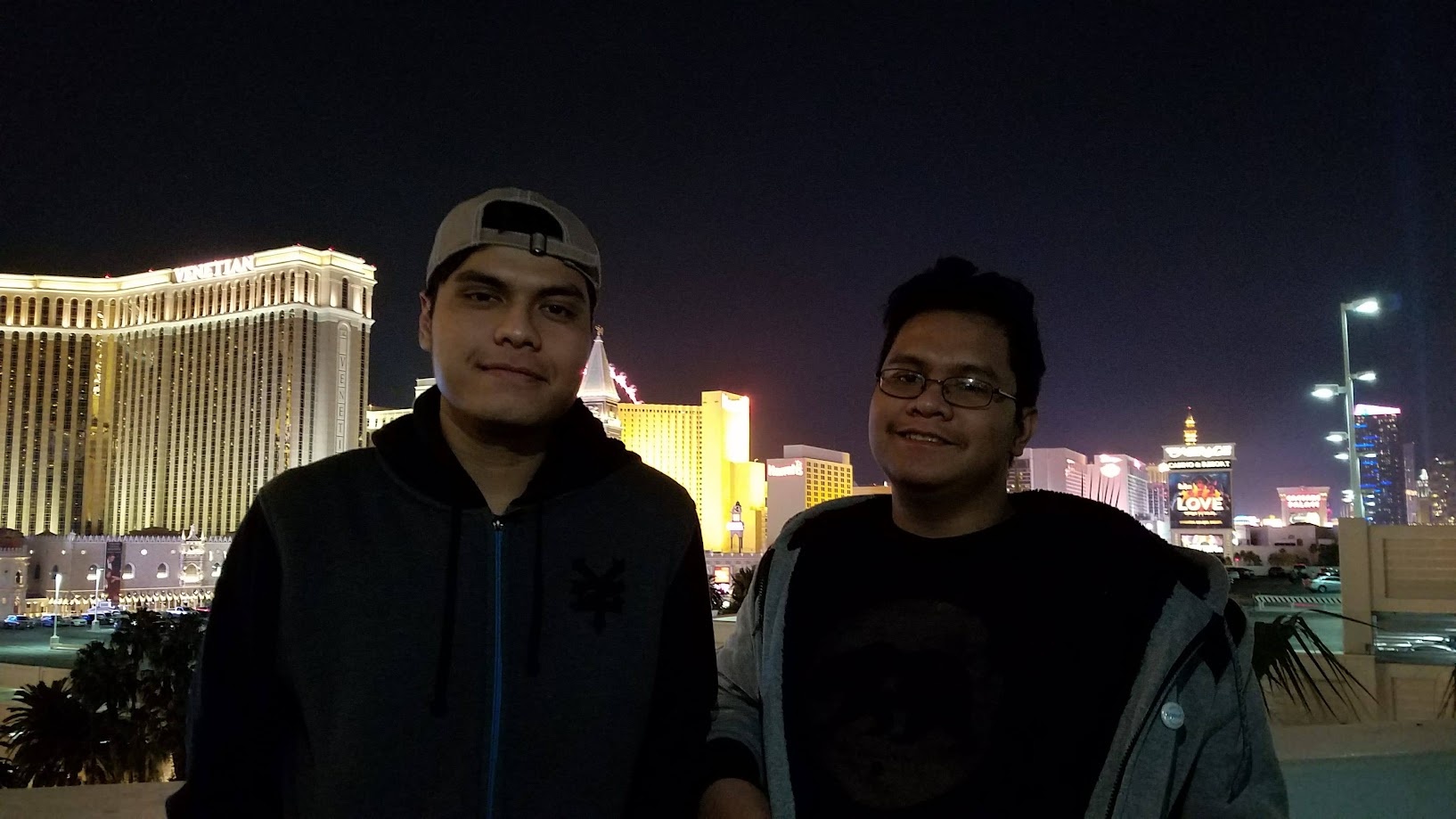 Two of us on the Las Vegas Strip at night with the Venetian behind