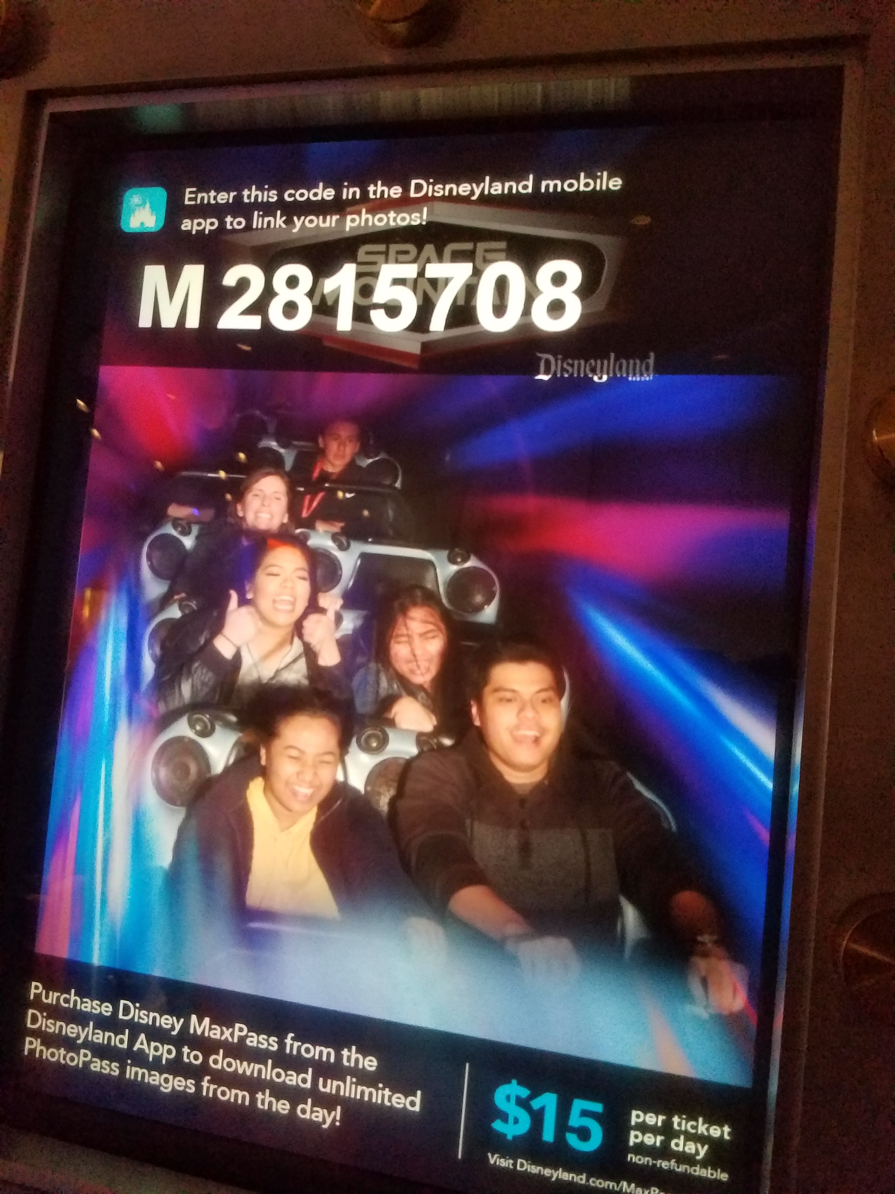 The Space Mountain ride photo on the screen at the exit, five of us in one car