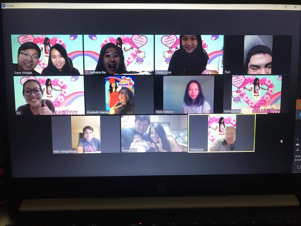 Zoom birthday party on a laptop screen, everyone on Hello Kitty backgrounds