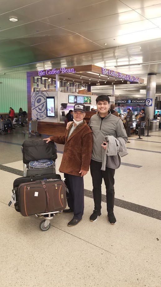 With family at LAX arrivals beside a luggage cart