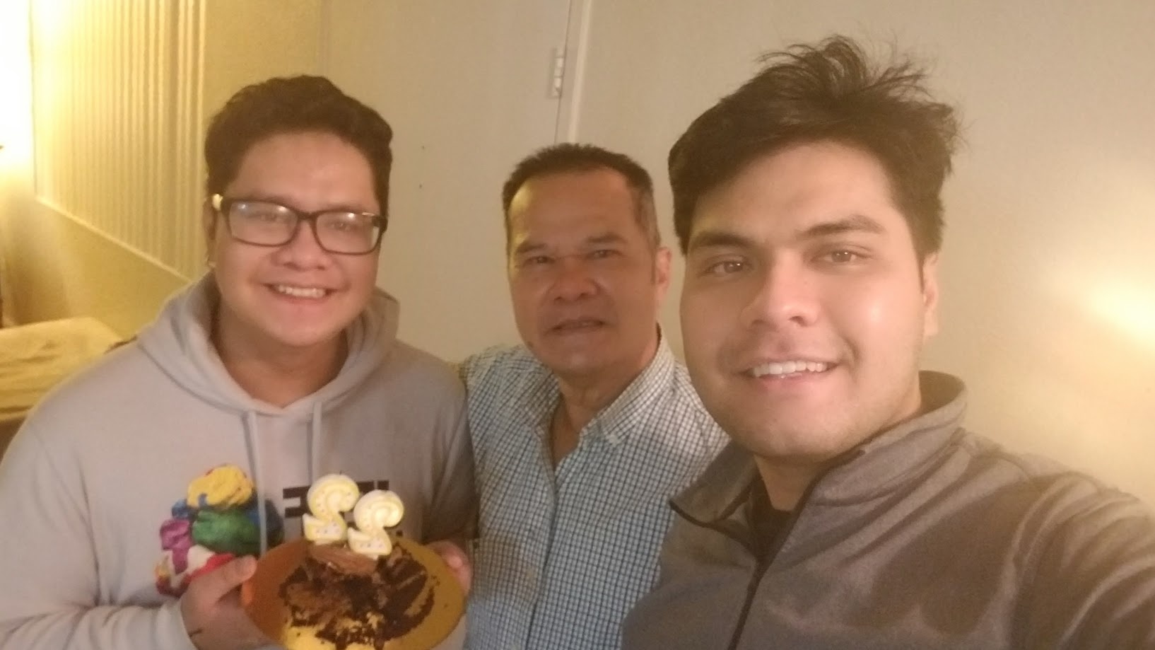 Three of us with a birthday cake at home