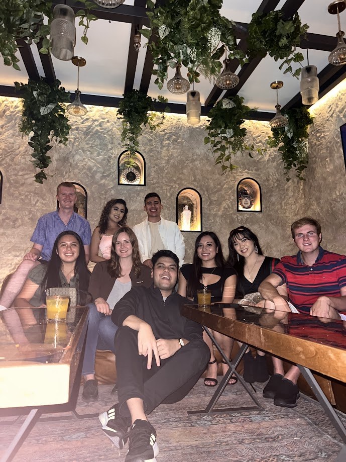Group photo at a plant filled lounge