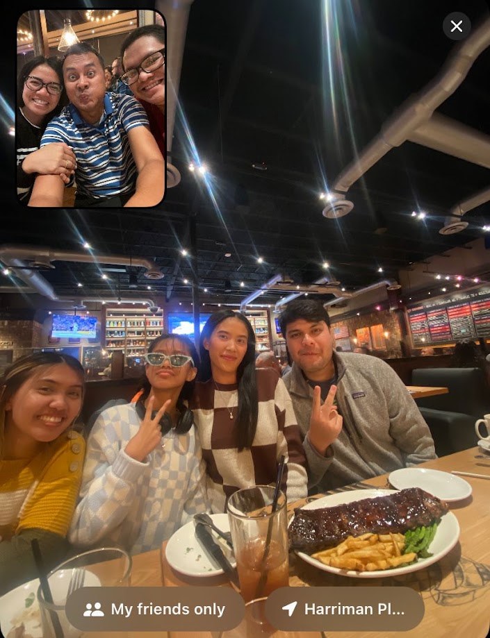 FaceTime from a restaurant table with a rack of ribs in front of us