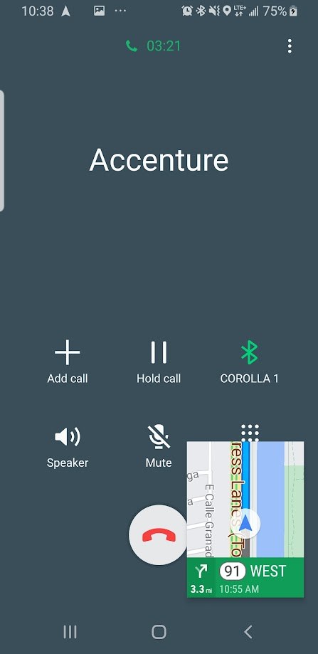 Phone screen showing a call from Accenture while driving