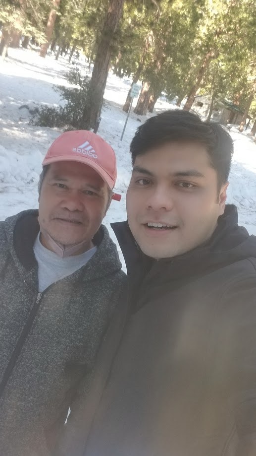 Selfie with my father among the snow covered pines