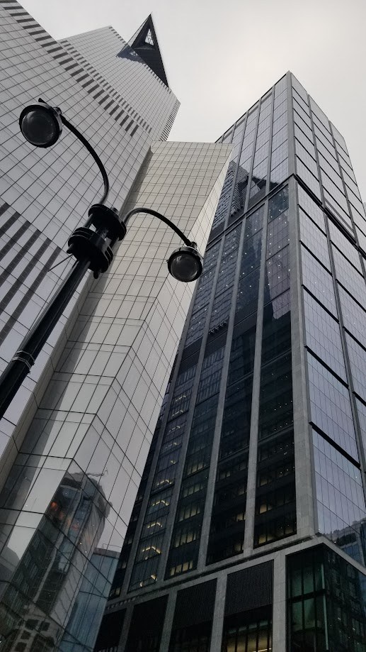 Looking straight up at the glass towers of midtown Manhattan