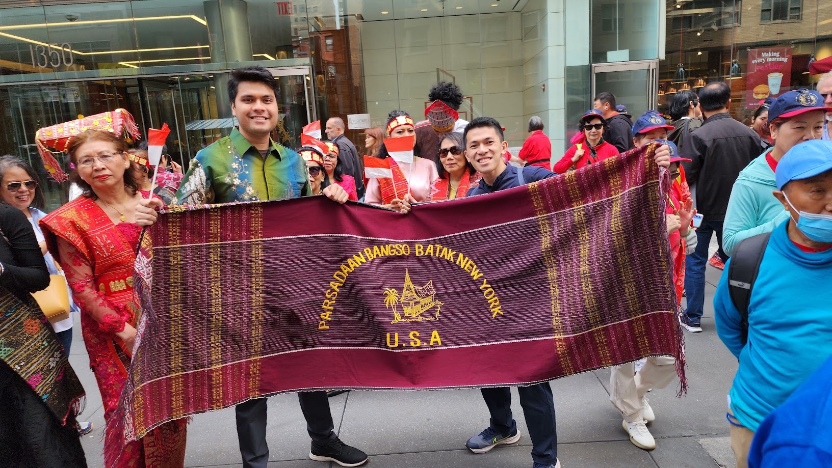 Carrying the Parsadaan Bangso Batak New York banner along the parade route