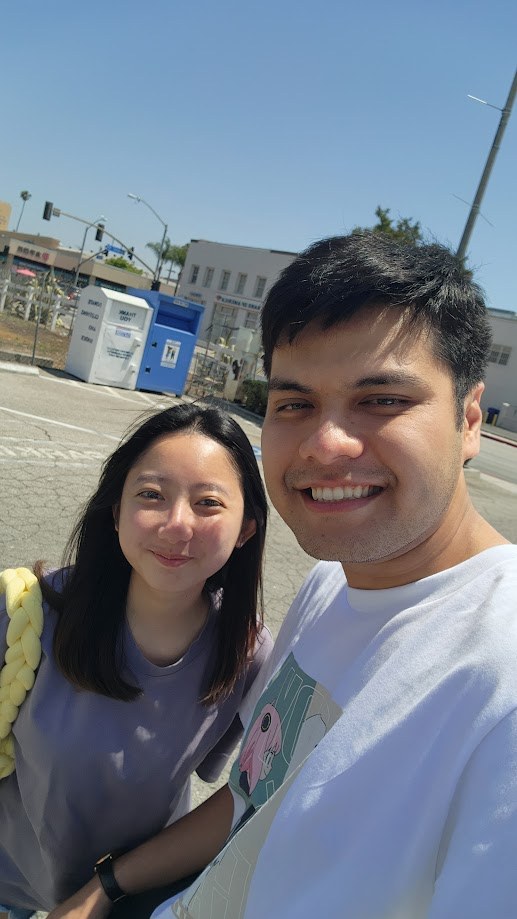Selfie with a friend on a bright empty street back in California
