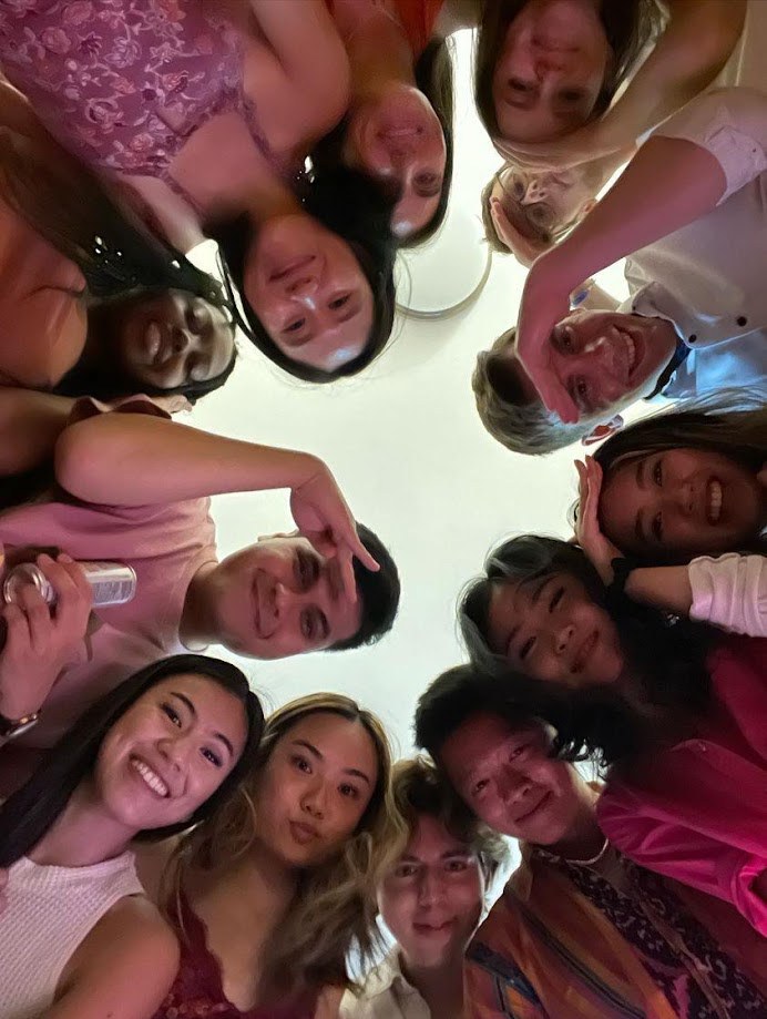 Everyone leaning into a circle for an overhead group photo