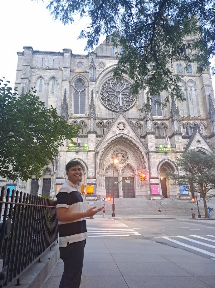 Standing across the street from the Cathedral of St John the Divine at dusk