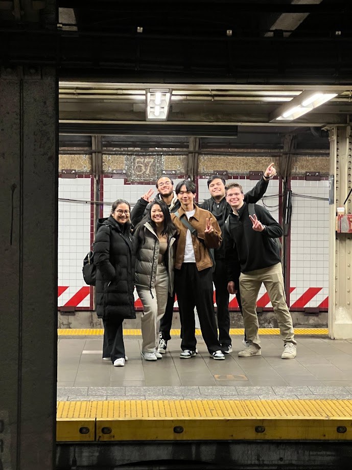 Six of us posing on the subway platform at 57th Street