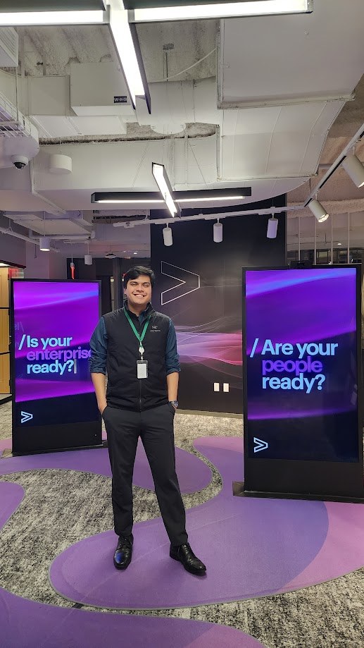 Standing between two Accenture screens reading is your enterprise ready and are your people ready