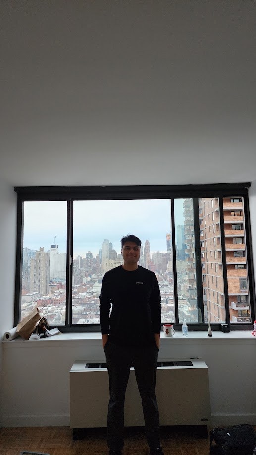 Standing in the emptied New York apartment with the city out the window