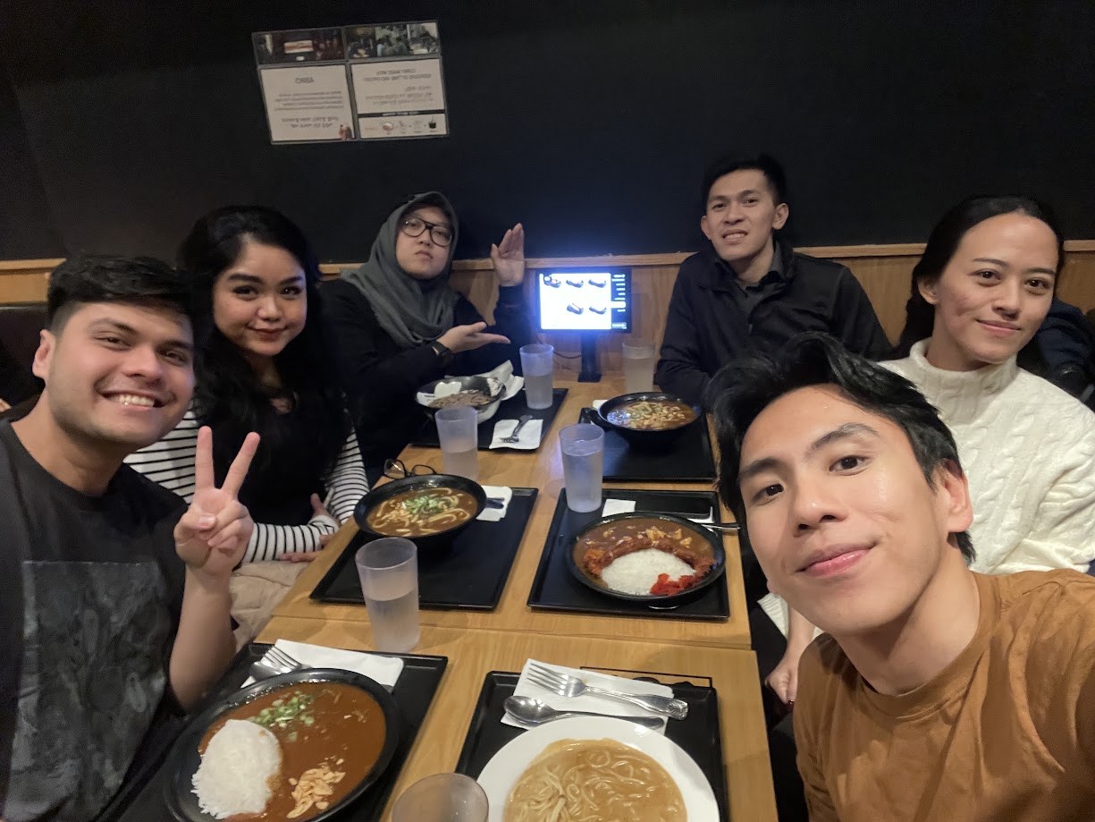 Six of us around a table of Japanese curry and udon after work