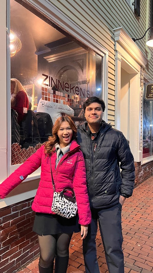 Outside a Belgian waffle shop in Cambridge on a winter evening