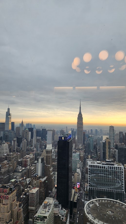 The Empire State Building and midtown from high up as the sun goes down
