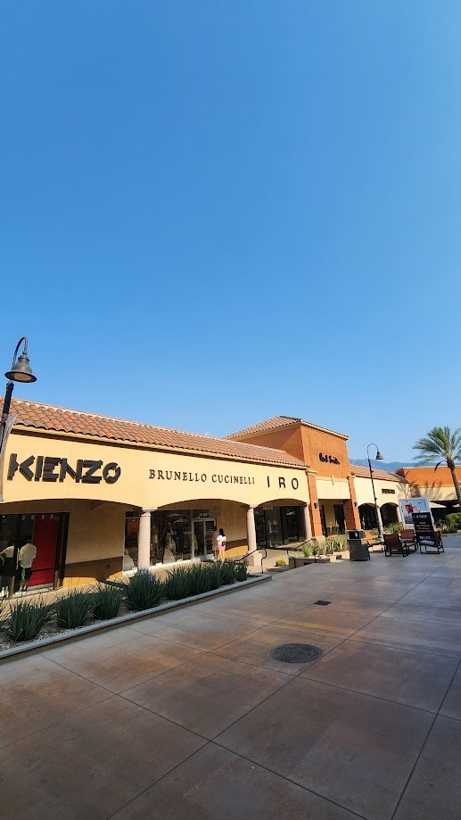 The Kenzo and Brunello Cucinelli storefronts at the Desert Hills outlets
