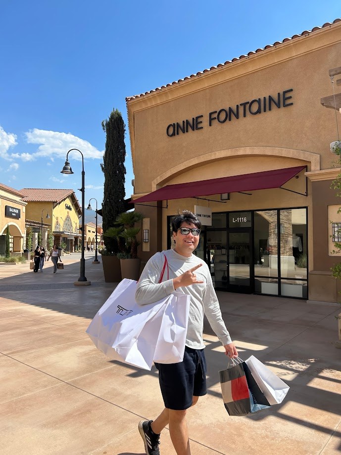 Walking past the Anne Fontaine store with an armful of shopping bags